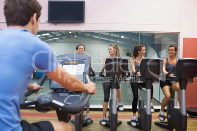 Happy women at spinning class