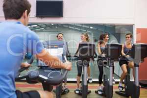 Happy women at spinning class