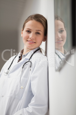 Smiling doctor in a hallway