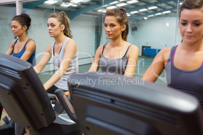 Four women at spinning class