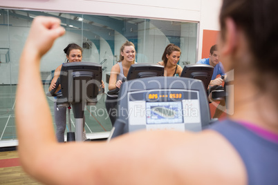 Happy people in spinning class