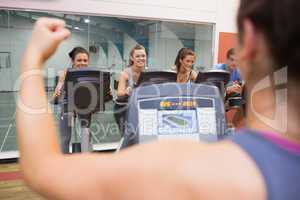 Happy people in spinning class