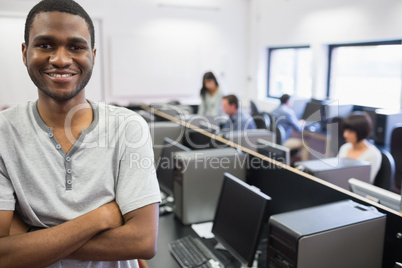 Student standing in computer room Student standing in computer room