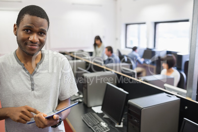 Student in computer room using tablet pc