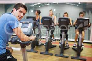 Male instructor at spinning class