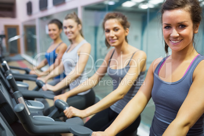 Smiling women at spinning class