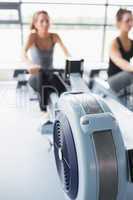 Rowing machine being used in gym