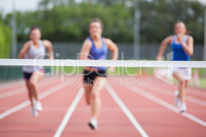 Athletes racing towards finish line