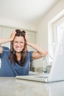 Woman getting angry about her laptop