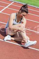 Female runner with ankle injury