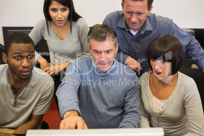 People looking shocked computer monitor