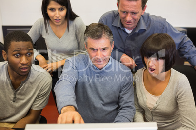 People looking shocked computer monitor People looking shocked computer monitor