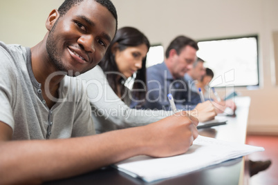 Man looking up from a lecture