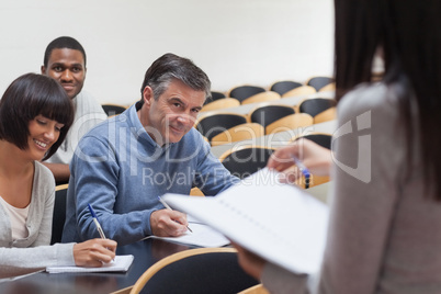 Students smiling in lecture