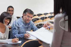 Students smiling in lecture