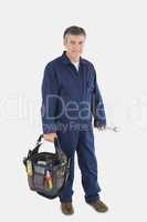 Mechanic carrying tool bag