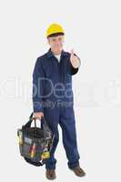 Mechanic with tool bag showing thumbs up sign