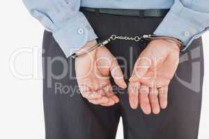 Businessman in formals with handcuffs