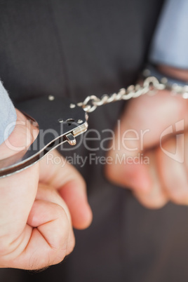 Close-up of businessman with handcuffs