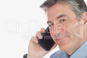 Mature businessman using cell phone