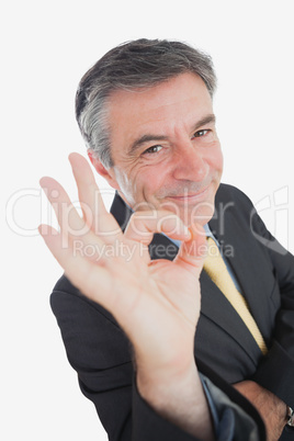 Businessman showing ok sign