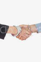 Close-up of handcuffed handshake