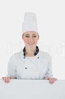 Female chef with billboard