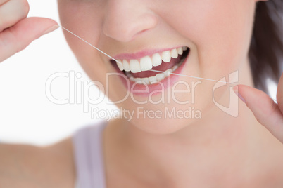 Woman using dental floss