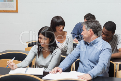 Students talking in lecture hall
