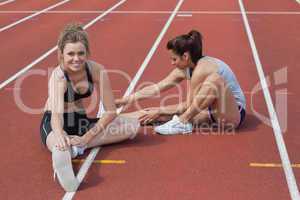 Women stretching on the track