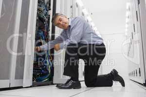 Man fixing server wires