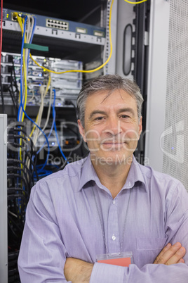 Technician standing in front of servers