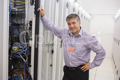 Technician leaning against server