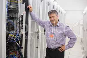 Technician leaning against server