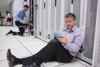 Various technicians working on servers