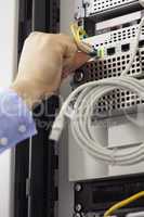 Man inserting USB wire