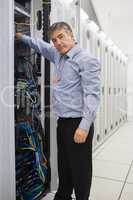Technician working and repairing a server