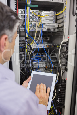 Technician controlling the server with a digital tablet