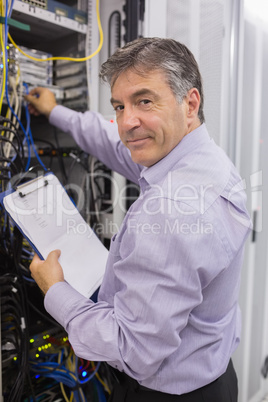 Data center worker checking the servers