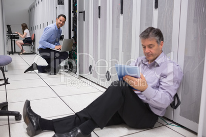 Technician working on the ground with tablet pc