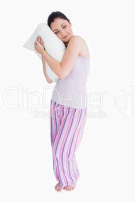 Standing woman sleeping on a pillow