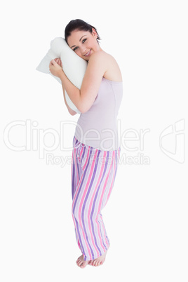 Standing woman relaxing on her comfortable pillow