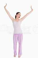 Standing woman stretching and yawning