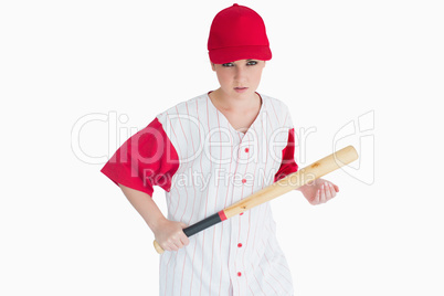 Woman holding a bat seriously