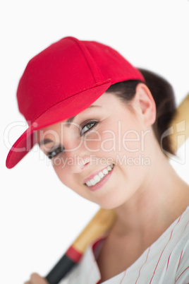 Happy woman with baseball bat and hat