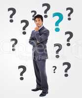Businessman thinking on question mark background