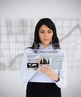 Businesswoman reading a virtual newspaper