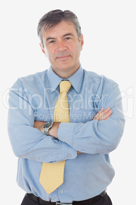 Portrait of mature businessman with arms crossed