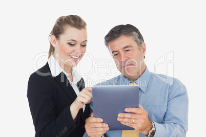 Business people using tablet together