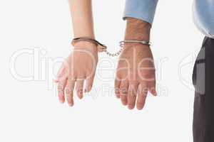 Businesspeople handcuffed together